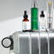 A selection of SkinCeuticals skincare products displayed on a silver suitcase, including a vitamin C serum, a hydrating serum, a corrective essence mist, and a sunscreen.