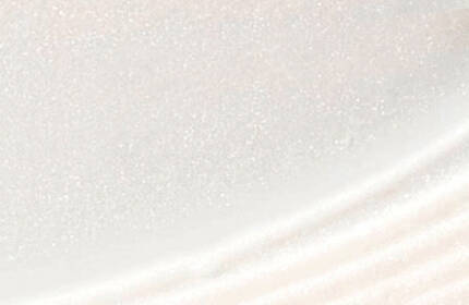 A close-up, abstract view of a smooth, shiny white surface with subtle texture.