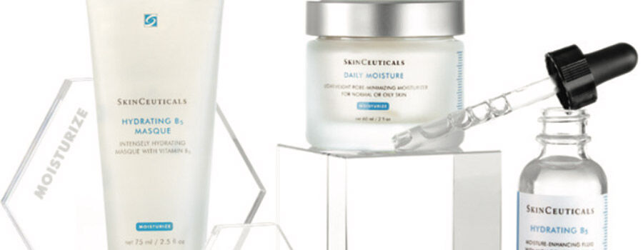 A selection of SkinCeuticals skincare products, including a hydrating mask, daily moisturiser, and serum on a display.