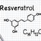 Diagram of the molecular structure of Resveratrol, labeled with its chemical formula C14H12O3, alongside a pen on a notepad with grid lines.