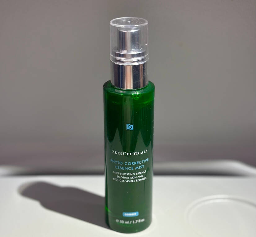A bottle of Skinceuticals Phyto Corrective Essence Mist on a neutral background, designed for soothing and hydrating skin.
