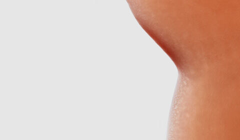 Abstract image featuring smooth drops of foundation in various shades on a white background.