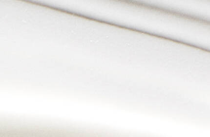 Abstract image featuring smooth, wavy lines in shades of white, creating a minimalist and serene aesthetic.
