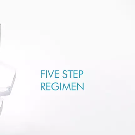 Three skincare products from SkinCeuticals are displayed on a clear acrylic stand. The bottles include a dark serum, a brown glass dropper bottle, and a larger bottle with a pump, all against a clean, white background.