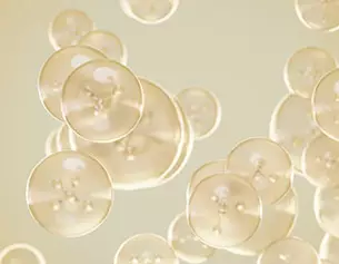 A cluster of translucent bubbles or spheres floating against a soft, light background, creating a sense of depth and movement.