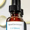 SkinCeuticals C E Ferulic Vitamin C Serum with yellow droplets behind