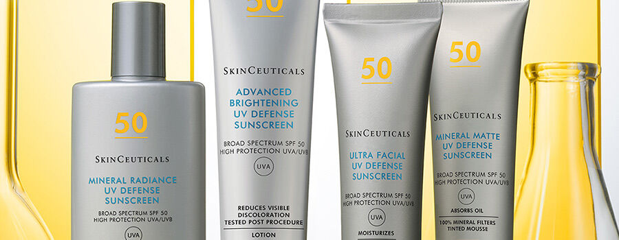 Alt text: A collection of four SkinCeuticals sunscreen products displayed against a yellow background, featuring different formulations labeled "Mineral Radiance," "Advanced Brightening," "Ultra Facial," and "Matte UV Defense," all with SPF 50.