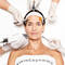 A woman is receiving a facial treatment, with various beauty tools being held around her face by gloved hands. She has a calm expression, and her hair is pulled back with a headband.