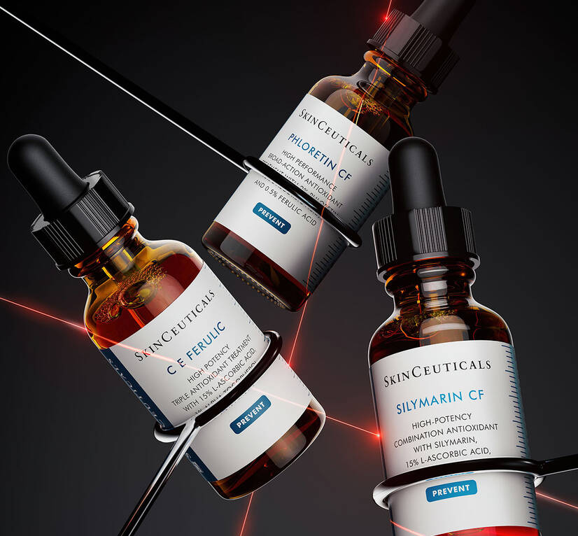 Three SkinCeuticals serum bottles arranged dynamically, featuring C E Ferulic, Phloretin CF, and Silymarin CF against a dark background.