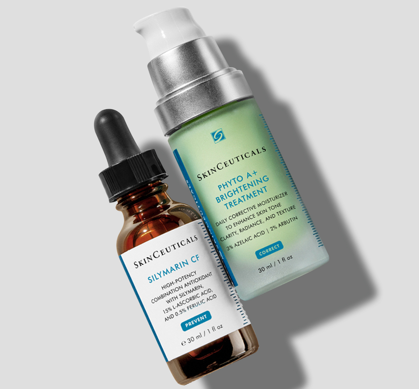 Birdseye image of Silymarin CF serum and Phyto A+ Brightening Treatment moisturiser lying diagonally and flat against a grey background, creating a shadow