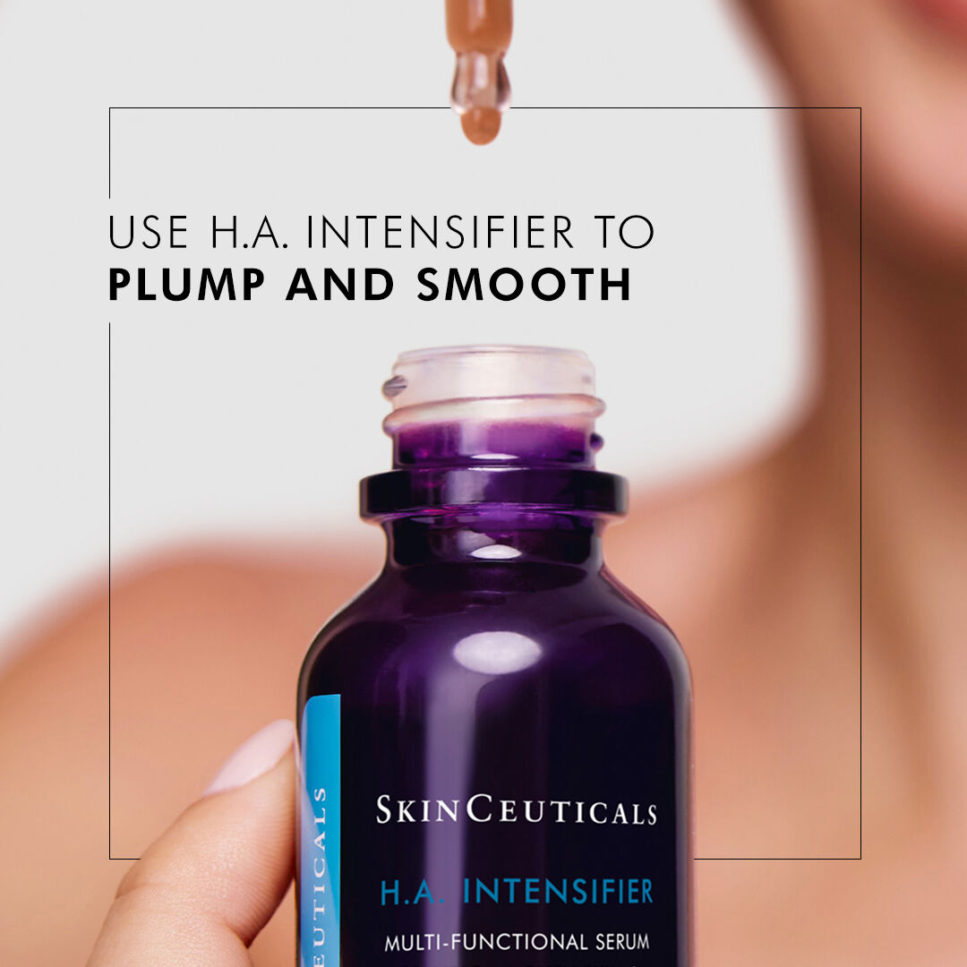 Woman dropping H.A. Intensifier serum formula from a pipette, back into the bottle. Woman is blurred in background, with the serum in focus. Text reads “Use H.A. Intensifier to plump and smooth”. 