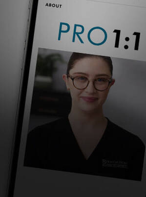 A close-up of a mobile phone screen displaying the SkinCeuticals website, featuring a smiling professional in a black uniform.