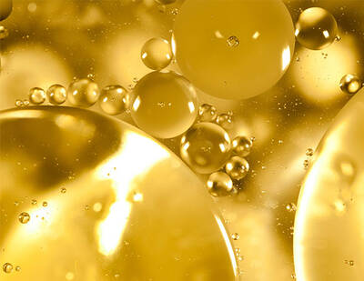 Close up of ferulic acid ingredient - golden coloured molecules