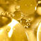 Close up of ferulic acid ingredient - golden coloured molecules
