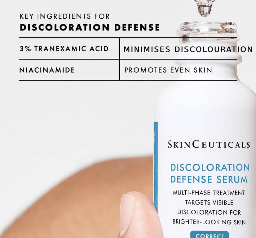 A drop of Discoloration Defense Serum falling back into the bottle. Text reads: Key ingredients: 3% tranexamic acid: minimises discolouration; niacinamide: promotes even skin