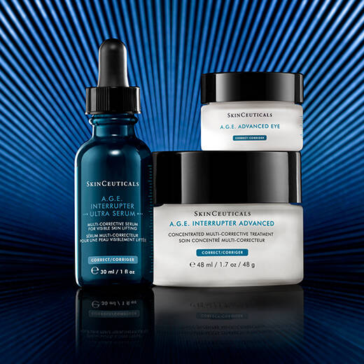A bottle of SkinCeuticals C E Ferulic serum is featured against a dark background, with dynamic red and gray abstract shapes surrounding it, highlighting its 20-year anniversary.