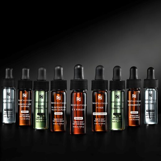 A bottle of SkinCeuticals C E Ferulic serum is featured against a dark background, with dynamic red and gray abstract shapes surrounding it, highlighting its 20-year anniversary.